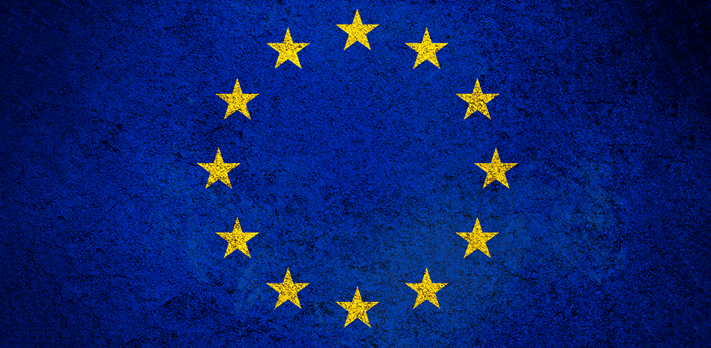 European Union flag with yellow stars on a blue background.