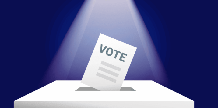 Illustration of a ballot paper with the word 'VOTE' being inserted into a ballot box under a spotlight