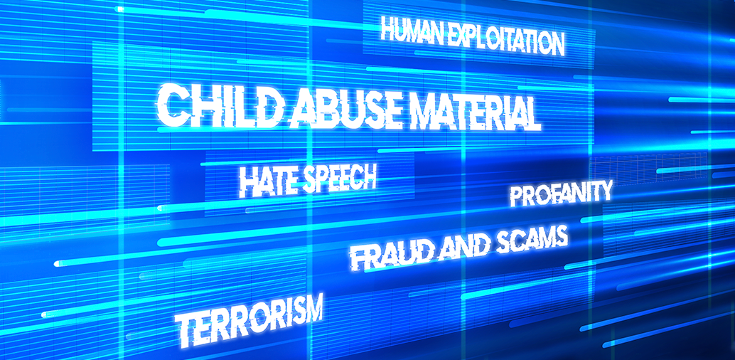 Digital screen with words such as 'Child Abuse Material,' 'Human Exploitation,' 'Hate Speech,' 'Fraud and Scams,' 'Profanity,' and 'Terrorism' highlighted.